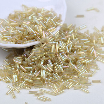 Бисер стеклярус блестящий 2х6 мм 50 г Золотистый светлый радужный