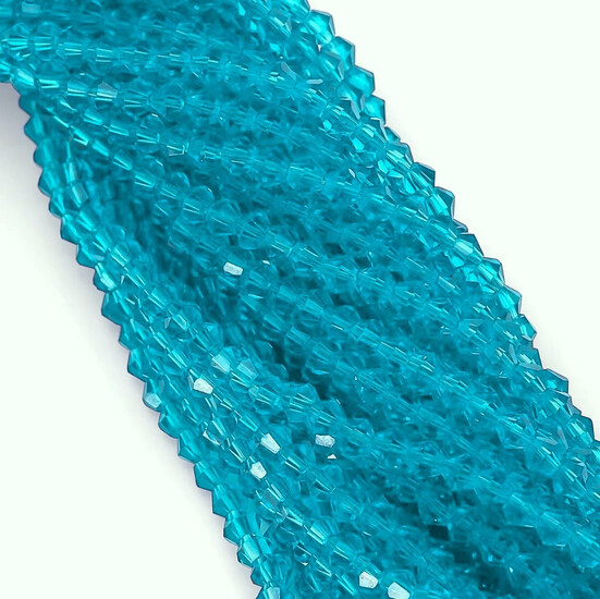 Бусины хрустальные Биконус 5,3х5 мм Ø 1 мм (+-53 шт.) Голубой темный прозрачный